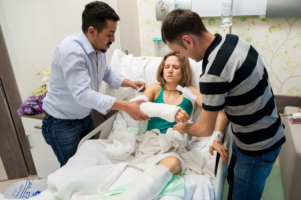 Rannveig Aamodt getting fitted with back brace after climbing accidet